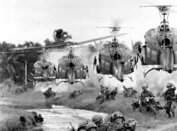 Ferrying South Vietnamese rangers, U.S. helicopters swoop in on a landing zone on the fringe of a pineapple plantation in the Mekong Delta on August 21, 1967