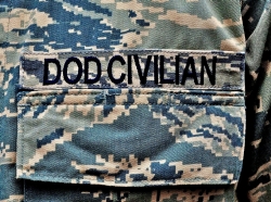 Close-up shot of the uniform of a member of the Department of Defense Civilian Expeditionary Workforce