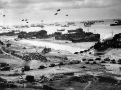 Landing ships putting cargo ashore on Omaha Beach, mid-June, 1944