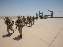 Marines unload from an MV-22B Osprey at Al Asad Air Base, Iraq, June 4, 2018