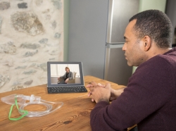 Patient consulting with his doctor via videochat over his laptop, photo by Henfaes/Getty Images