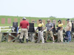Competitors prepare to fire during the 2015 Civilian Marksmanship Program National Trophy Pistol Matches in Camp Perry, Ohio, photo by Sgt. 1st Class Raymond J. Piper/U.S. Army