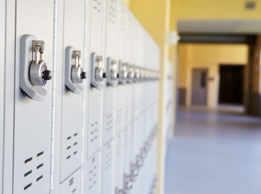 A row of lockers in a high school, photo by Monkey Business Images/Getty Images