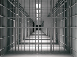 Interior view of prison corridor and cells. Photo by Rawf8 / Getty Images