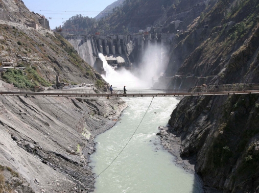 Laborers walk on a bridge near the 450-megawatt hydropower project at Baglihar Dam on the Chenab river which flows from Indian Kashmir into Pakistan, October 10, 2008