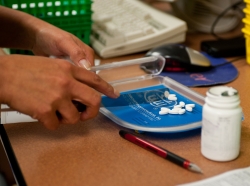 A 28th Medical Support Squadron pharmacy technician counts pills
