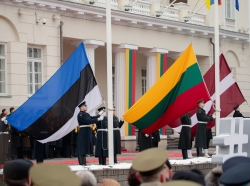 Flags of Estonia, Lithuania, and Latvia are raised in a ceremony outside the presidential palace in Vilnius, Lithuania, during the country's centenary celebration, February 16, 2018, photo by Birute/Getty Images
