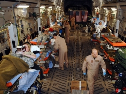 Members of an Expeditionary Aeromedical Evacuation Squadron monitor patients during an aero-medical evacuation mission from Balad Air Base, Iraq, to Ramstein Air Base, Germany, February 25, 2007, photo by MSgt. Scott Reed/U.S. Air Force