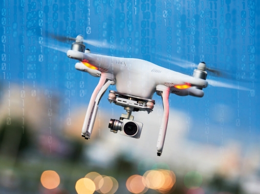 Drone quadcopter over a background of binary code