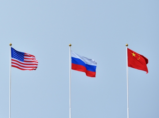 Flags of the United States, Russia, and China in the sky