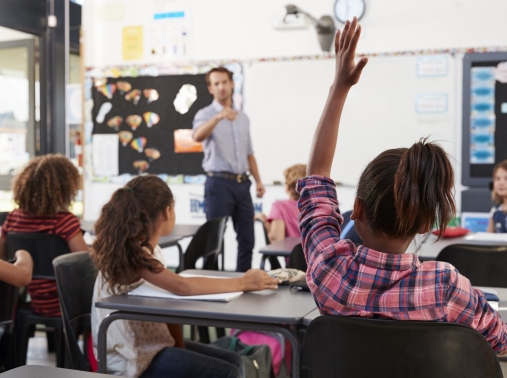 Teacher calling on an elementary student in class