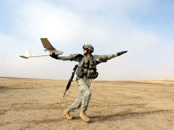 A solider using an RQ-11B Raven, a small hand-launched remote-controlled unmanned aerial vehicle, in 2006, photo by SFC Michael Guillory/U.S. Army