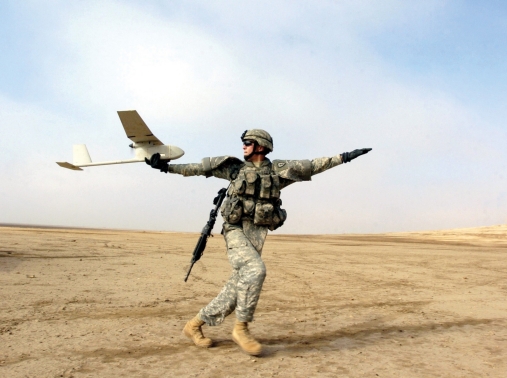 A solider using an RQ-11B Raven, a small hand-launched remote-controlled unmanned aerial vehicle, in 2006