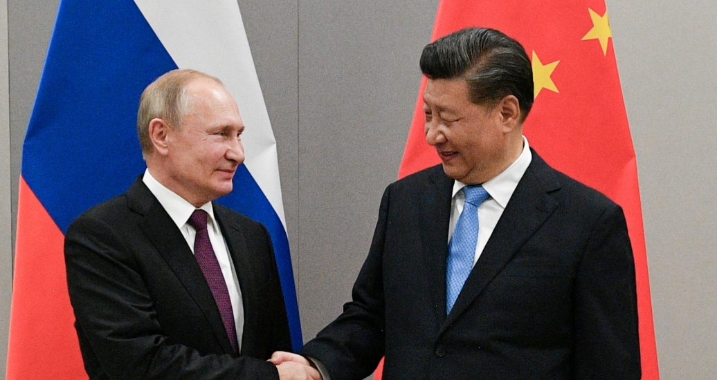 Russian President Vladimir Putin shakes hands with Chinese President Xi Jinping during their meeting on the sidelines of a BRICS summit, in Brasilia, Brazil, November 13, 2019