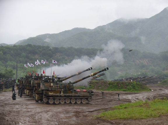 South Korean soldiers coordinate fires during a joint artillery exercise with U.S. soldiers near the Demilitarized Zone that separates North and South Korea, May 10, 2016, photo by Staff Sgt. Keith Anderson/U.S. Army