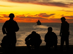 U.S. Marines and sailors post security from the Wasp-class amphibious assault ship USS Essex (LHD-2) off the coast of Southern Calif., December 4, 2020, photo by Lance Cpl. Cameron Rowe/U.S. Marine Corps