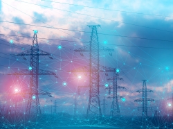 Electric power lines behind a network illustration, photo by kosssmosss/Adobe Stock