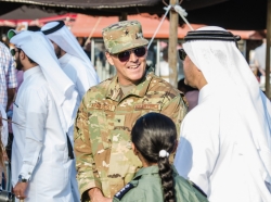 U.S. Air Force Brig. Gen. Jason Armagost, commander of the 379th Air Expeditionary Wing, talks with a Qatari Emiri Air Force dignitary at the Qatar Emiri Air Force Family Cultural Exchange at Al Udeid Air Base, Qatar, Dec. 1, 2017. The cultural exchange, hosted by the QEAF, was a relationship building event that gave families and members of Qatari, U.S. and coalition forces an opportunity to interact and learn about each others cultures. The event included cultural exhibits, regional animals, local food, games for children and more, photo by Staff Sgt. Patrick Evenson/U.S. Air National Guard