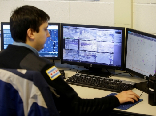 A police officer monitors the Police Observation Devices on computer screens at the 7th District police station in Chicago, Illinois, January 5, 2018