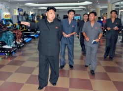 North Korea's leader Kim Jong-un visits a newly built arcade at the amusement house of the Rungna People's Pleasure Park