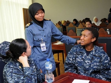 USS Dewey (DDG 105) Fire Controlmen Speak with a Royal Brunei Navy officer During CARAT  