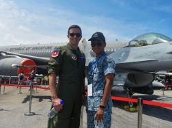A U.S. pilot stands next to a member of the Republic of Singapore Air Force
