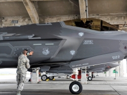 Senior Airman Colby Cook, 419th Aircraft Maintenance Squadron crew chief, inspects an F-35A Lightning II before takeoff at Kadena Air Base, Japan, Nov. 16, 2017. The F-35A is the Air Force's latest low observable fifth-generation fighter incorporating stealth technology, photo by Naoto Anazawa/U.S. Air Force