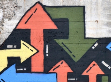 Graffiti arrows on wall