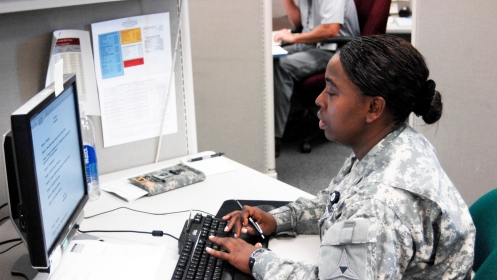 Sergeant Jennifer Jackson, III Corps, works at her computer station in the Inspector General’s office. 