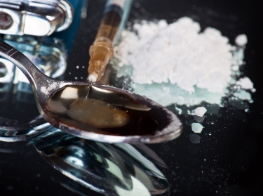 Syringe, spoon and lighter, concept of drug addiction 