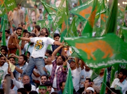 Supporters of the Pakistan Muslim League (N) party cheer their leader, Nawaz Sharif (not pictured), during a campaign rally in Islamabad, Pakistan, May 2013