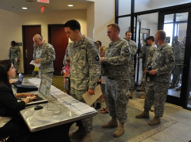 Soldiers line up to check in for the CivilianJobs.com job fair sponsored by the Fort Campbell, Ky., Army Career and Alumni Program office