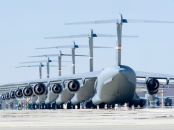 C-17 Globemaster IIIs sit on the flight line at Edwards Air Force Base, California, in preparation for six-ship formation testing
