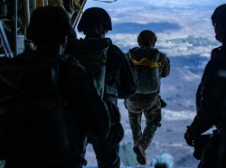 U.S Marines static line jump from a KC-130J Hercules over Drop Zone Basilone on Marine Corps Base Camp Pendleton, Calif., December 10, 2020, photo by Lance Cpl. Drake Nickels/U.S. Marine Corps