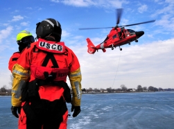 Crew members from Coast Guard Air Station Detroit perform helicopter-rescue training, March 10, 2010