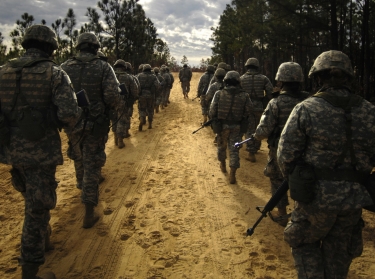 U.S. Army recruits practice patrol tactics while marching during basic training at Fort Jackson, South Carolina, December 6, 2006, photo by SSgt Shawn Weismiller/U.S. Air Force
