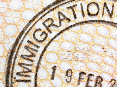 Immigration entry stamp on the inside page of a passport