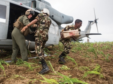 Nepalese soldiers unload aid and relief supplies from a UH-1Y Venom in the Kavrepalanchowk District, May 11, 2015