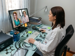 Doctor on a video call with nurse and patient, photo by doble-d/Getty Images