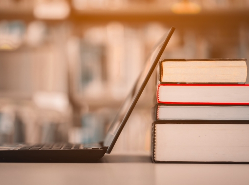 Books and a laptop in a library