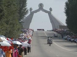 People take part in the celebrations for the National Liberation Day near the Arch of Reunification in the city of Pyongyang, North Korea, August 14, 2005, photo by Yuri Maltsev/Reuters