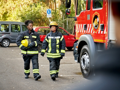 Two firefighters in protective workwear