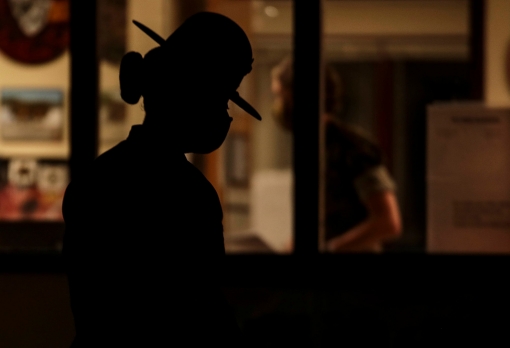 A U.S. Marine Corps drill instructor prepares to initiate 'Lights,' the start of her platoon's morning routine