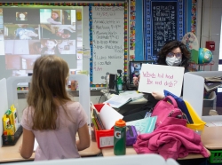 Second-grade teacher with white board, photo by Allison Shelley for EDUimages/ CC BY-NC 4.0