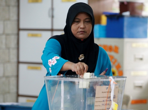 A woman casts her vote in Port Dickson, Malaysia, October 13, 2018