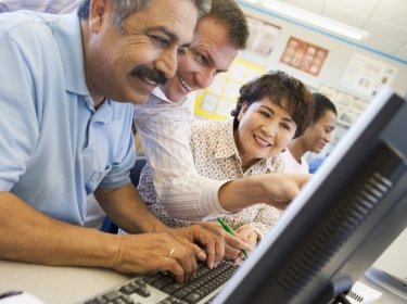 Mature students learning computer skills, photo by Monkey Business Images/Adobe Stock
