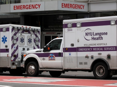 Ambulances seen outside NYU Langone Hospital's Emergency entrance during the coronavirus disease (COVID-19) outbreak, in New York City, March 31, 2020, photo by Brendan McDermid/Reuters