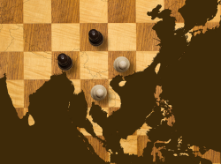 Old wooden chess board with map, photo by Chess board: ChrisAt/Getty Images/iStockphoto. Map: pc/Getty Images Chess pieces: TheUltimatePhotographer/iStockphoto