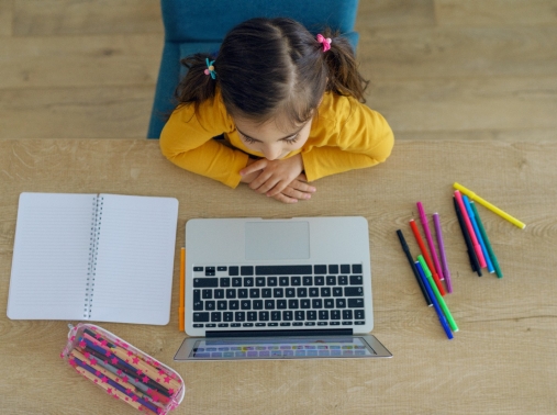 Young student participates in school remotely