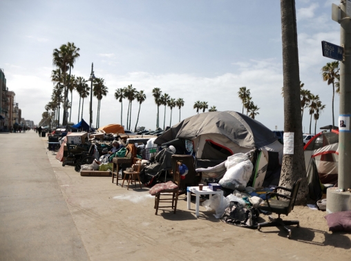Tents line a bike path on Venice Beach in Los Angeles, California, April 14, 2021